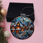 Beautiful Acrylic Ornament with a Stained Glass Look of: Vintage Village with Santa flying over moon